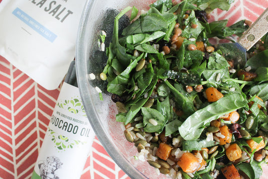 bowl with fall salad present on a surface