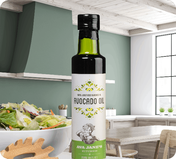 glass avocado oil bottle in a kitchen with salad and dining table in the background