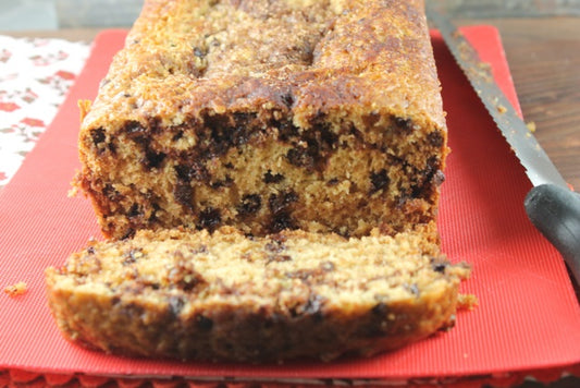 pumpkin chocolate chip bread with a sliced piece 